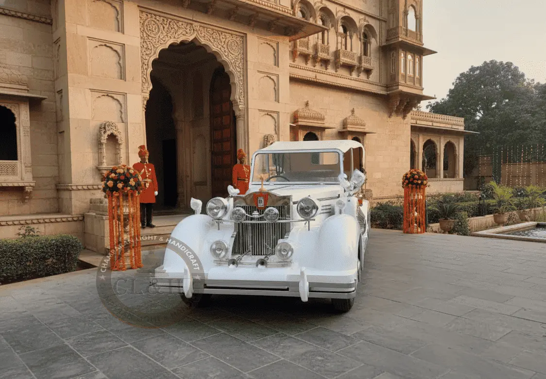 Beautifully maintained classic white vintage car parked outdoors.